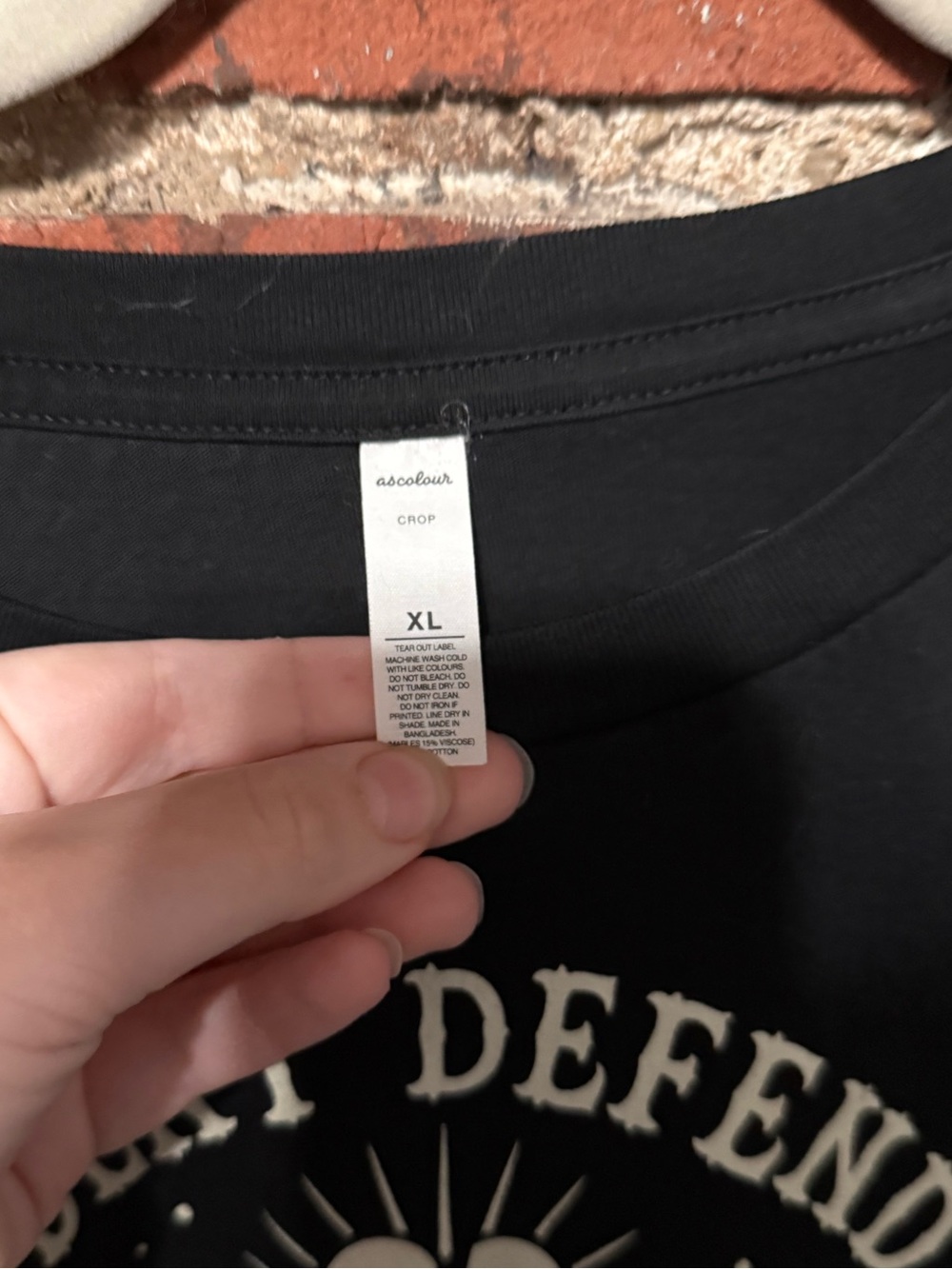 Black Graphic Crop Tee with 'Deny Defend Depose' Print - Picture 2 of 3